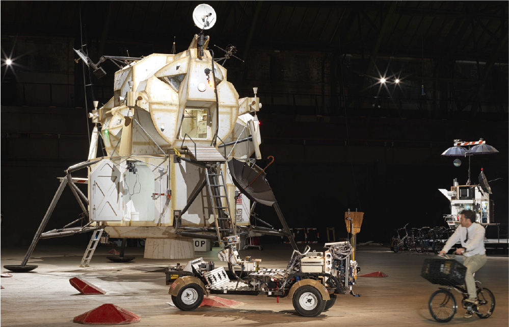 Tom Sachs studio installation with lunar module, rover, and space equipment